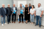 Na zdjęciu, od lewej stoją: Dariusz Šustik, Grzegorz Krowiak, Krzysztof Zawiła, Piotr Komraus, Agnieszka Świaczny, Szymon Korfanty, Agnieszka Walaszczyk, Łukasz Świgoniak